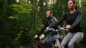 Beautiful couple cycling on the road video YouTube-miniature template
