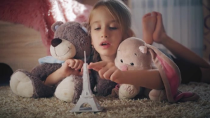 Brown Child playing with toys Thumbnail sa YouTube Template