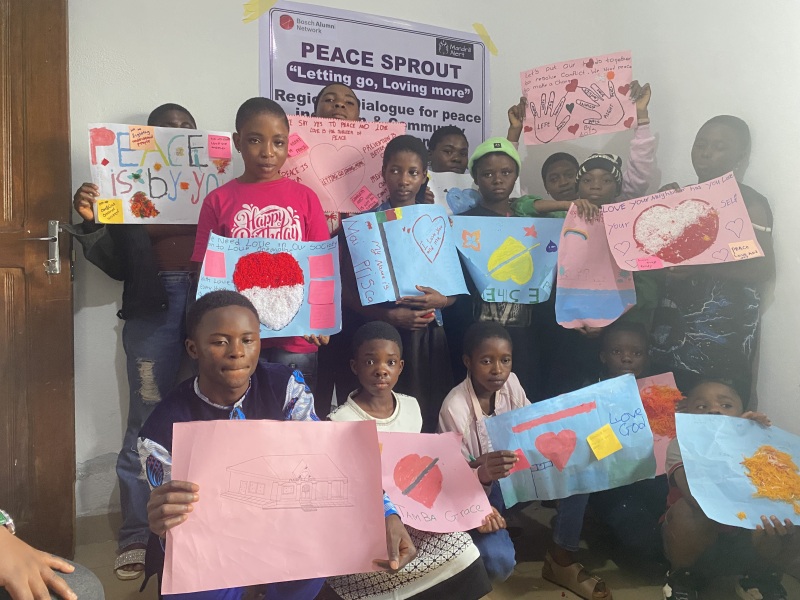 photo of children at the peace sprout event holding their drawing